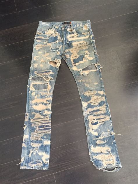 undercover distressed jeans.